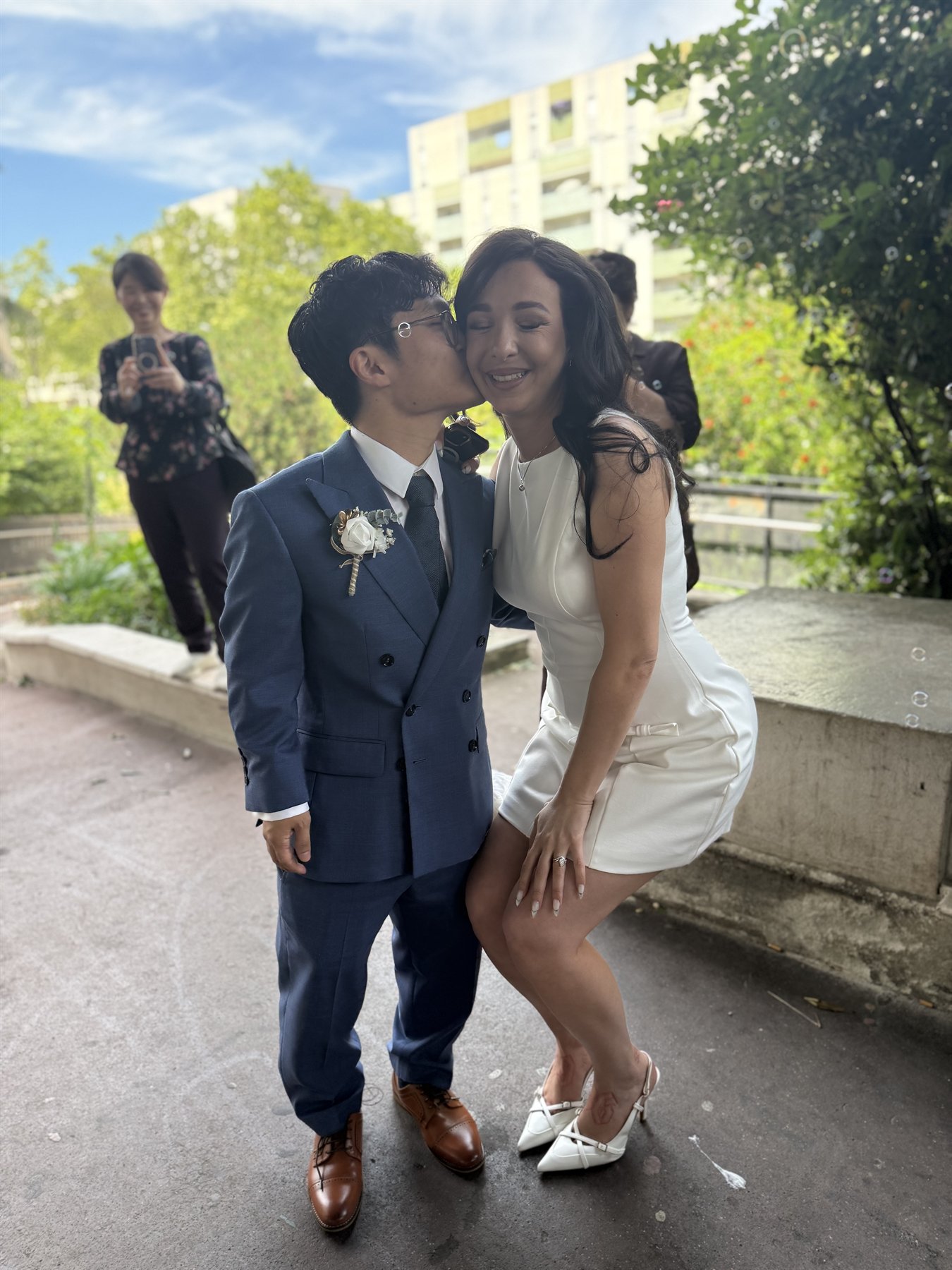 Elea and Isaac smiling in sunlight